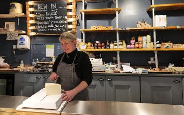 Trader slicing cheese