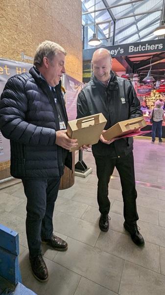 Steve being presented with his leaving gifts by Market Manager Mark Beck