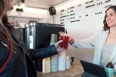 Jonah's Coffee trader serving a drink