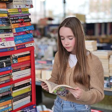 Girl reading children's book