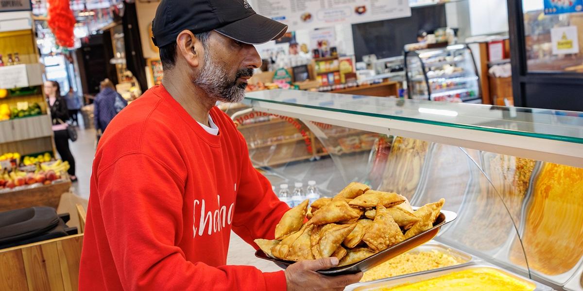 Chacha's trader with plate of samosas