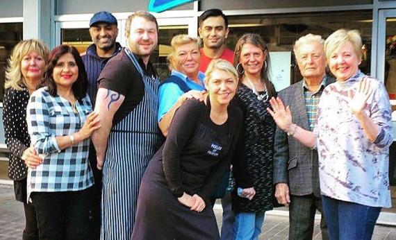 Market traders including Gail and Richard on the far right